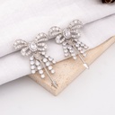 Aretes stud chongo con zirconia plata baño 18k premiun