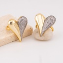 Anillo  forma de corazon dos tonos con zirconias baño 18k