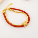 Pulsera doble layer con cuero trenzado salmon baño 18k