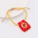 Pulsera ajustable con escapulario tejido a mano con  baño 18k