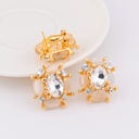 Aretes piedra opalo con zirconias patente omega y baño 18k