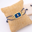 Pulsera correa ajustable de hilo metalizado en forma de ojo con zirconia esmaltado baño 18k 