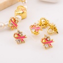 Dije chongo cancer esmaltado micropave baño 18k