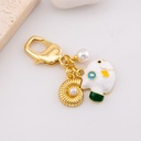 llavero con dijes pez y caracol de mar baño 18k