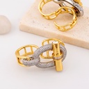 Anillo de dos dedos con zirconias dos tonos  baño 18k