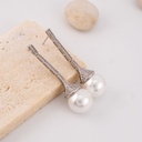 Aretes stud con perlas y zirconia baño 18k