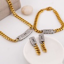Set arete, pulsera y collar de marca en acero inoxidable dos tonos