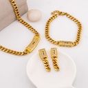 Set arete, pulsera y collar de marca en acero inoxidable