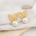 Aretes stud mariposa con zirconias y perlas baño 18k