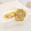 Brazalete chunky flor con zirconias  baño 18k