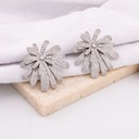 Aretes en forma de destellos con zirconias baño 18k