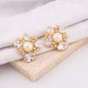 Aretes stud con zirconias y perlas baño 18k