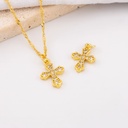 Dije en forma de cruz micropave y baño 18k