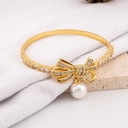 Pulsera chongo y perla colgante con zirconias baño 18k