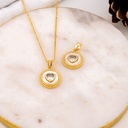 Dije de corazon transparente con concha nacar y  baño 18k