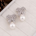 Aretes colgantes con perlas y zirconia baño 18k