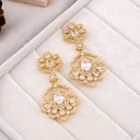 Aretes flor colgantes con zirconia dorado baño 18k