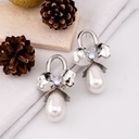 Aretes flor grande con perla plateados baño 18k