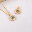 Dije flor madre perla centro turqueza baño 18k