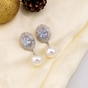 Aretes colgantes de perlas con zirconias baño 18k