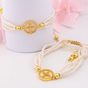 Pulsera ajustable con perlas baño 18k