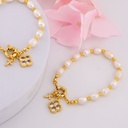 Pulsera de perlas de rio con broche y colgantes baño 18k