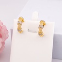 Argollas doble tono con zirconias baño 18k