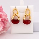 Aretes colgantes de carey baño 18k