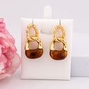 Aretes colgantes de carey baño 18k