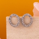 Aretes ovalados con zirconias baño 18k plat