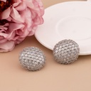 Aretes stud redondos con zirconias baño 18k plat