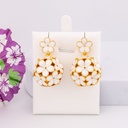 Aretes colgantes de flores baño 18k