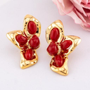 Aretes media flor baño 18k
