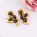 Aretes media flor baño 18k