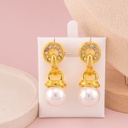 Aretes colgantes de perla baño 18k