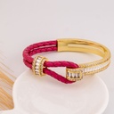 Brazalete de cuero y zirconias baño 18k fusia