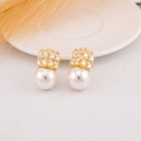 Aretes con zirconias y perla baño 18k