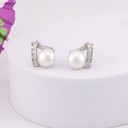 Aretes stud con perlas y zirconias baño 18k plat