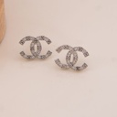 Aretes stud de marca con zirconias baño 18k