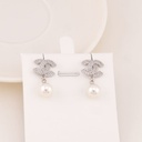 Aretes de marca colgantes baño 18k