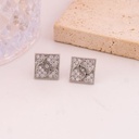 Aretes stud de marca con zirconias baño 18k plat