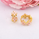 Argollas de trebol con zirconias baño 18k rosa