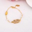 Pulsera de marca con perlas y zirconias baño 18k