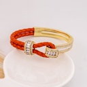 Brazalete de cuero y zirconias baño 18k rojo