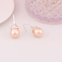 Aretes perlas shell en forma de gota baño 18k