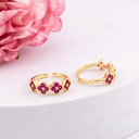 Anillo ajustable de trebol con zirconias baño 18k fusia