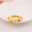Anillo ajustable de estrella con zirconias baño 18k