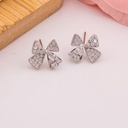 Aretes stud coquette con zirconias baño 18k