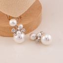 Aretes colgantes de perlas y zirconias baño 18k
