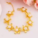 Pulsera de flores con perlas baño 18k